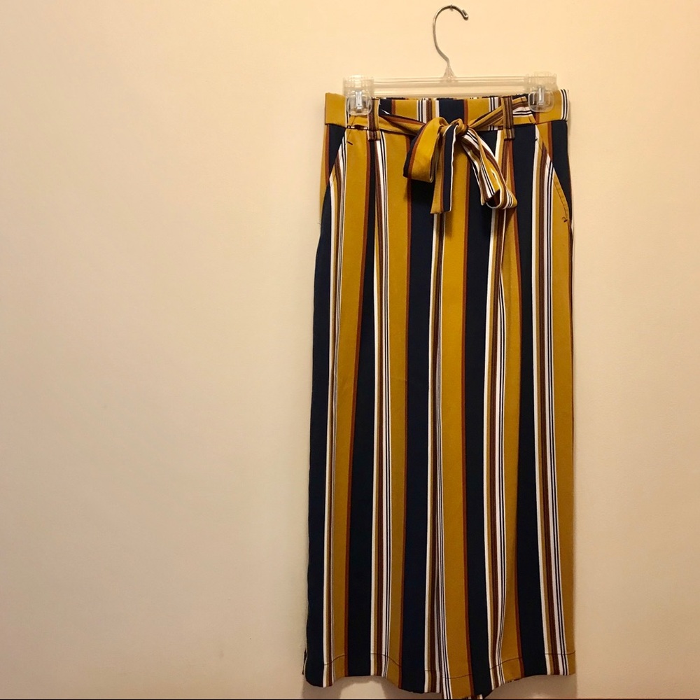 Blue, gold, brown, and white high waisted pants
